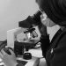 where are the focus controls on a microscope located