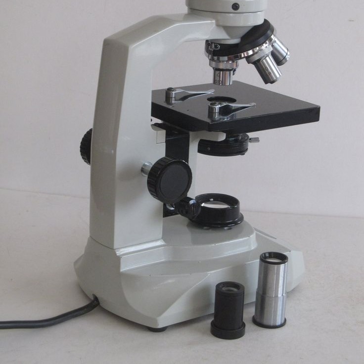 what does the base do on a microscope